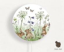 wandlamp rond in the undergrowth